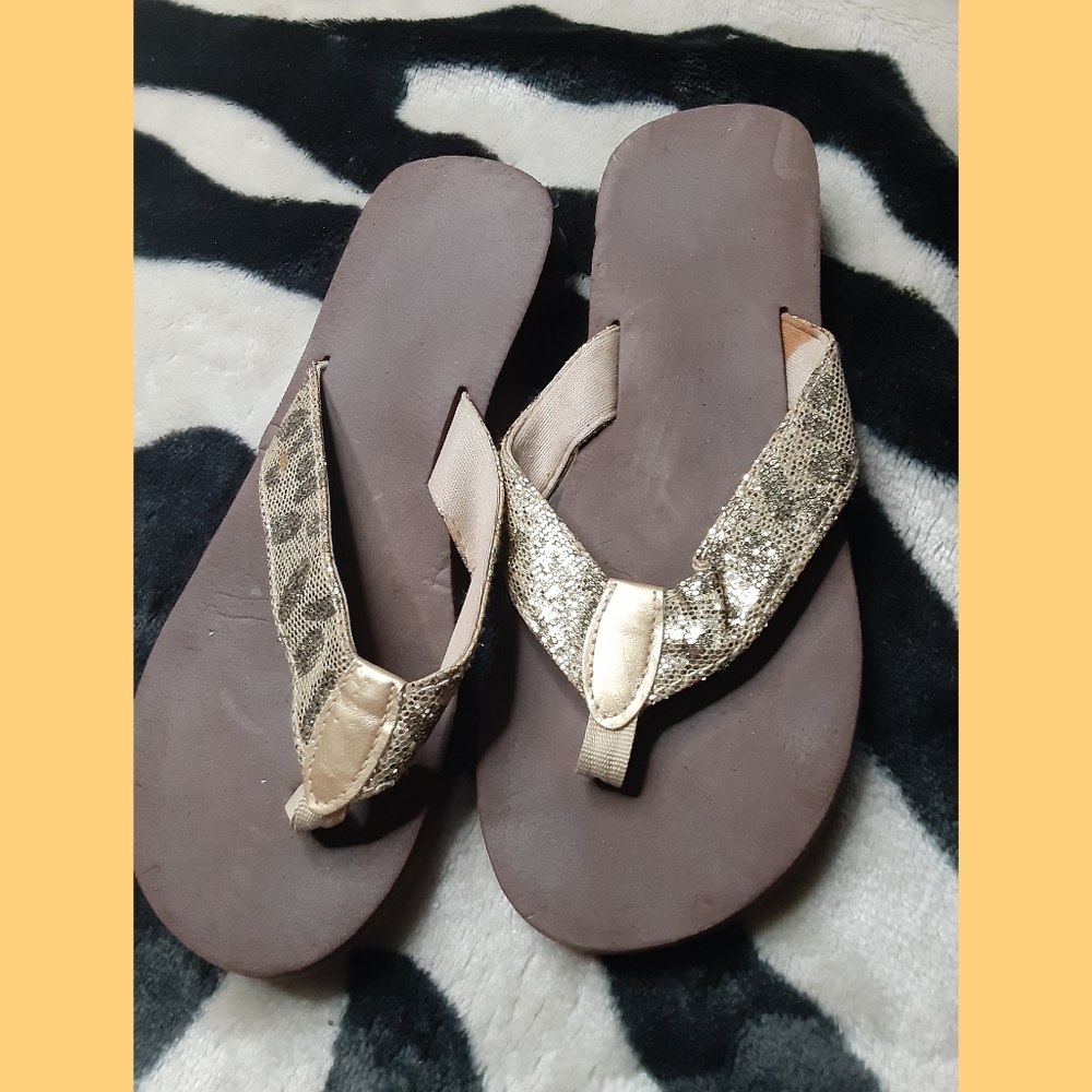 Gold sparkly flipflops